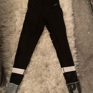 pink black leggings with pink logo at bottoms